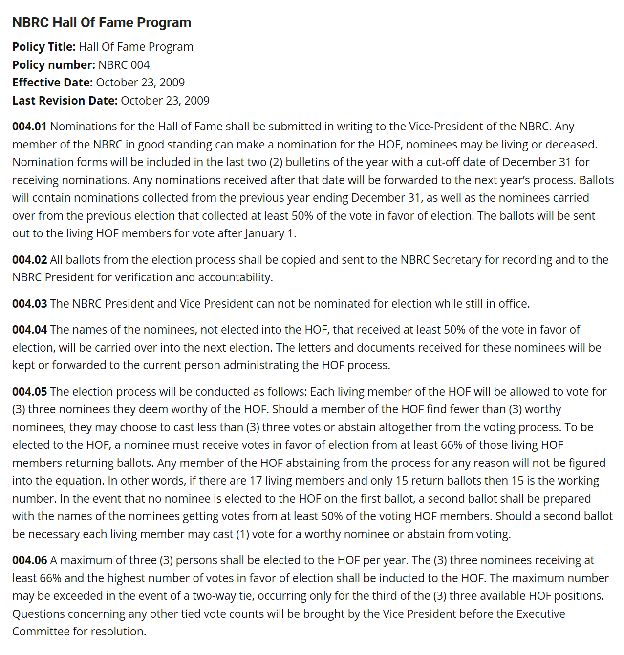 A large wooden building with two windows and a door.