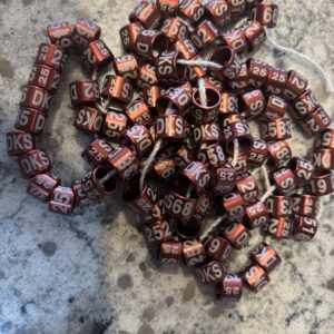 A pile of dice sitting on top of the ground.