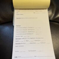 A receipt sitting on top of a leather couch.