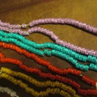 |A string of beads with numbers on them.