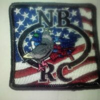 A patch with an eagle and the words " nb rc " on it.