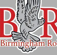 A gray and red logo with an eagle flying over it.|A black truck with the back of it.