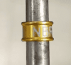 |A purple string of beads is sitting on the table.